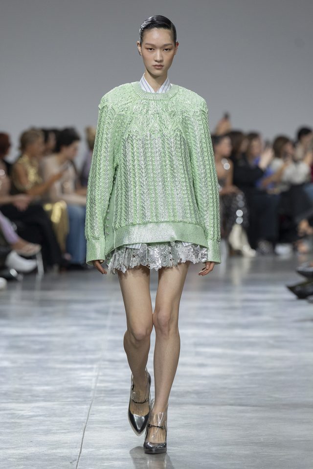 A model wearing an original creation from the womenswear spring summer 2025 ready to wear collections in Paris from the house of Rabanne