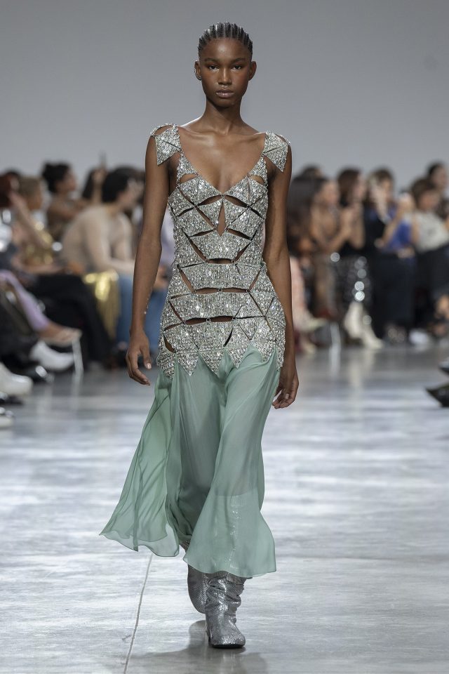 A model wearing an original creation from the womenswear spring summer 2025 ready to wear collections in Paris from the house of Rabanne