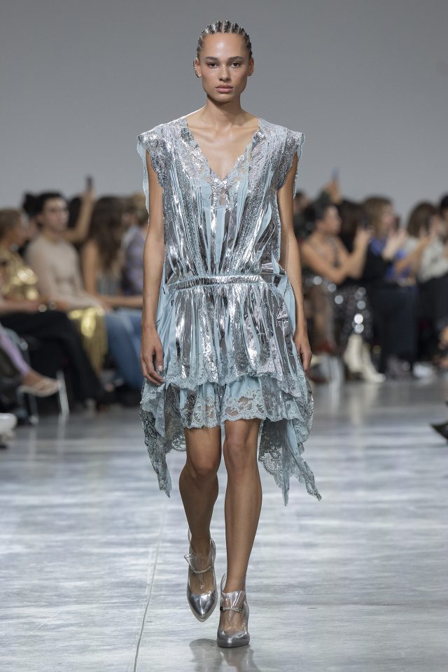 A model wearing an original creation from the womenswear spring summer 2025 ready to wear collections in Paris from the house of Rabanne