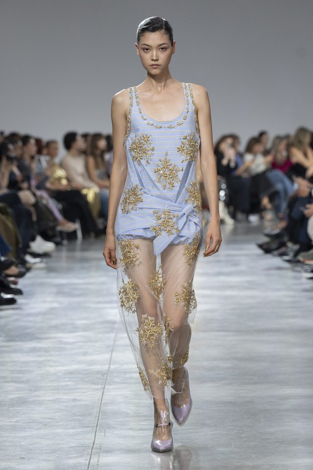 A model wearing an original creation from the womenswear spring summer 2025 ready to wear collections in Paris from the house of Rabanne