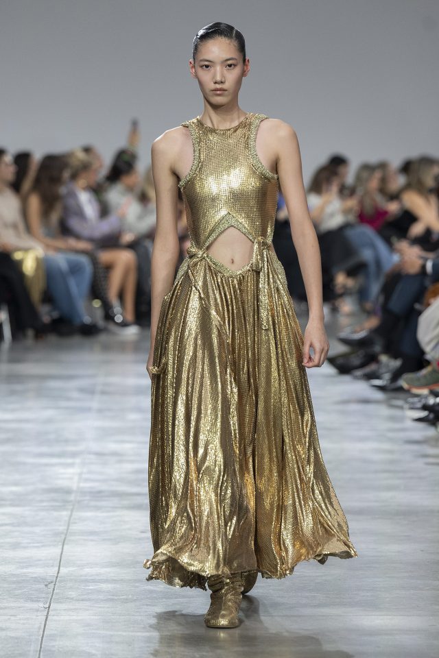 A model wearing an original creation from the womenswear spring summer 2025 ready to wear collections in Paris from the house of Rabanne