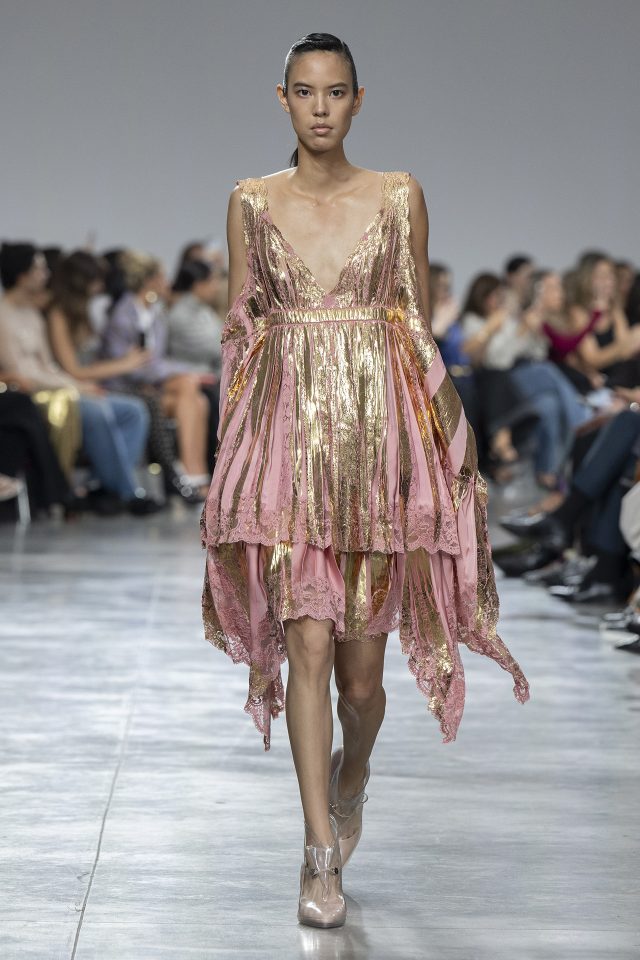 A model wearing an original creation from the womenswear spring summer 2025 ready to wear collections in Paris from the house of Rabanne