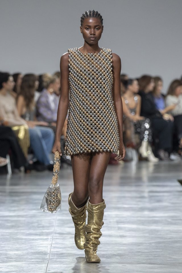 A model wearing an original creation from the womenswear spring summer 2025 ready to wear collections in Paris from the house of Rabanne