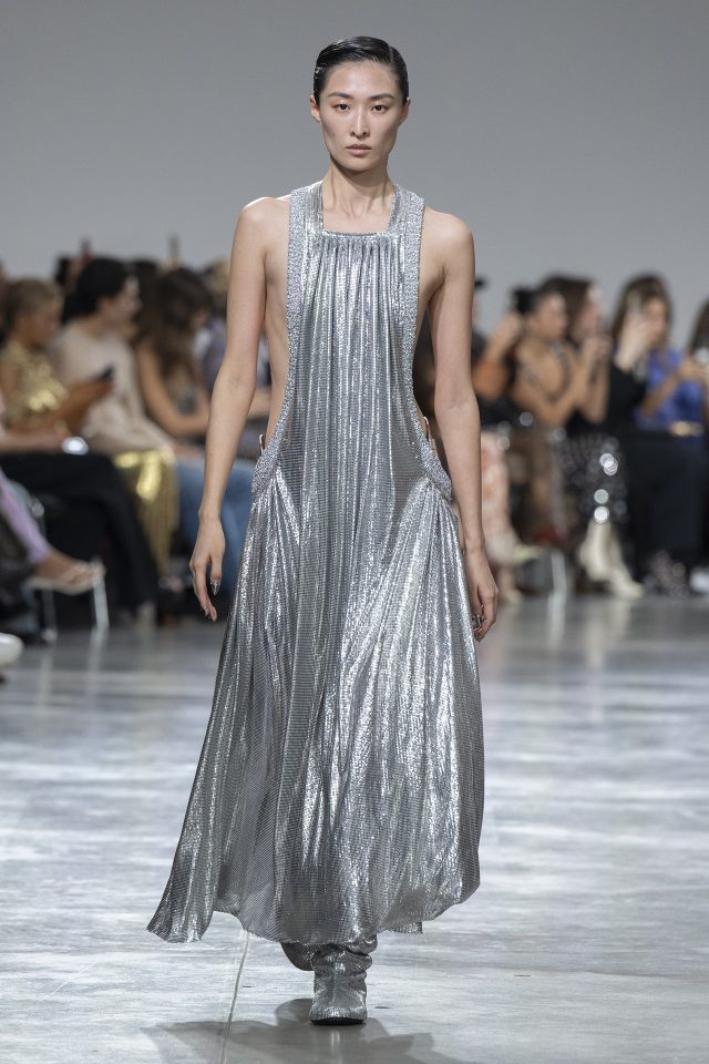 A model wearing an original creation from the womenswear spring summer 2025 ready to wear collections in Paris from the house of Rabanne