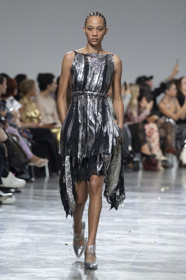 A model wearing an original creation from the womenswear spring summer 2025 ready to wear collections in Paris from the house of Rabanne