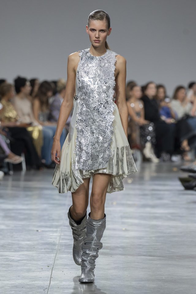 A model wearing an original creation from the womenswear spring summer 2025 ready to wear collections in Paris from the house of Rabanne