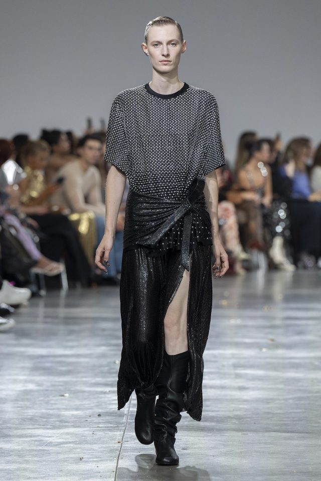 A model wearing an original creation from the womenswear spring summer 2025 ready to wear collections in Paris from the house of Rabanne