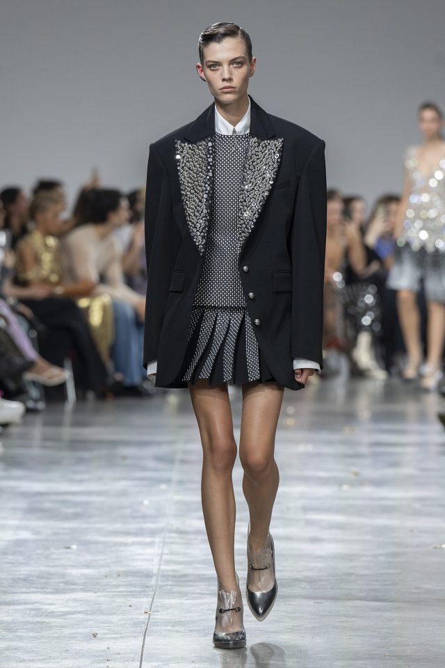 A model wearing an original creation from the womenswear spring summer 2025 ready to wear collections in Paris from the house of Rabanne