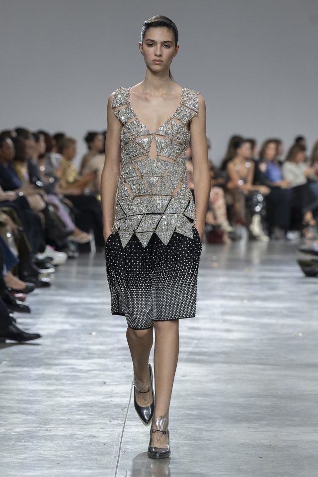 A model wearing an original creation from the womenswear spring summer 2025 ready to wear collections in Paris from the house of Rabanne